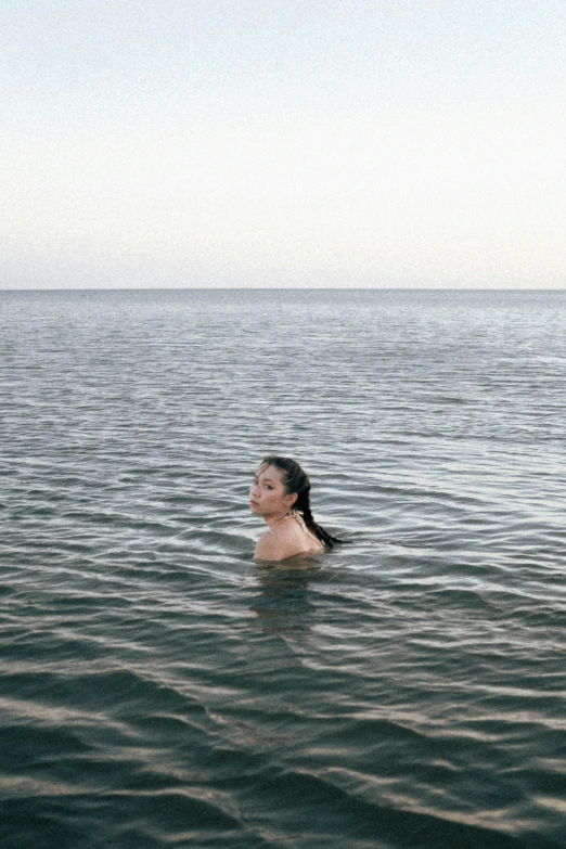 woman swimming in open water at the beach