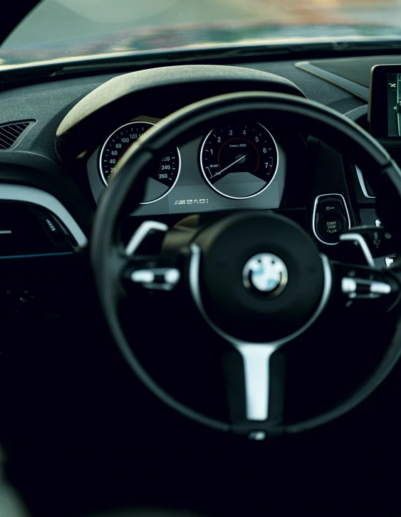 view from inside the car with steering wheel and dashboard