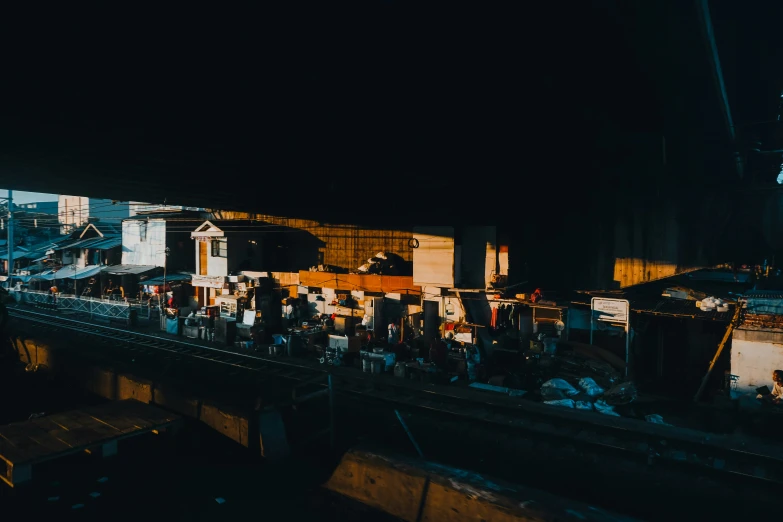 several people are standing on a high above bridge