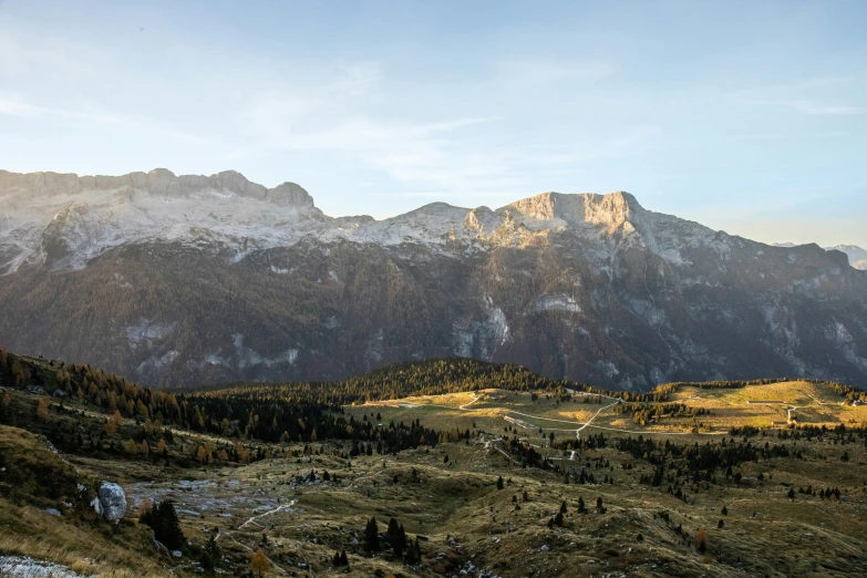 a view of some snowy mountains with the tops in the foreground