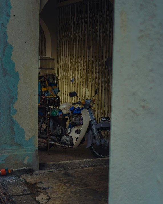 a motor bike is parked in front of a doorway