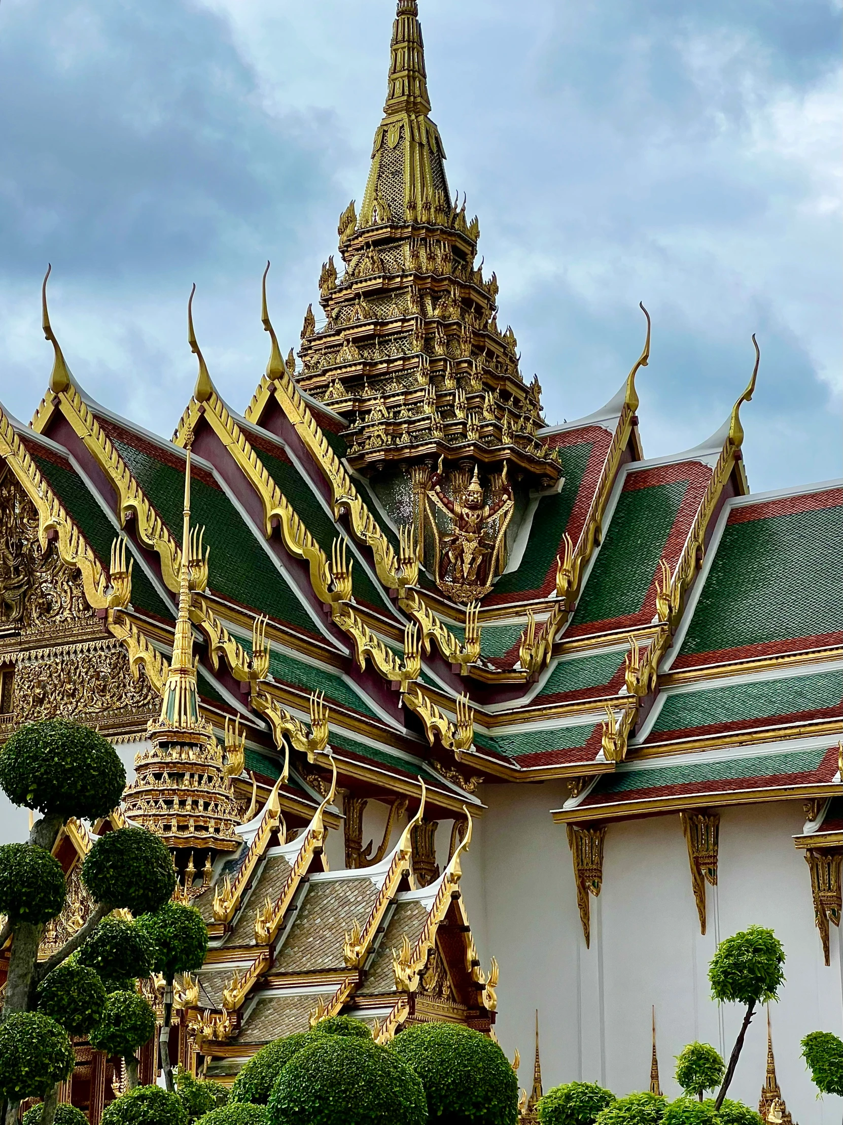 an old building with gold and green decorations