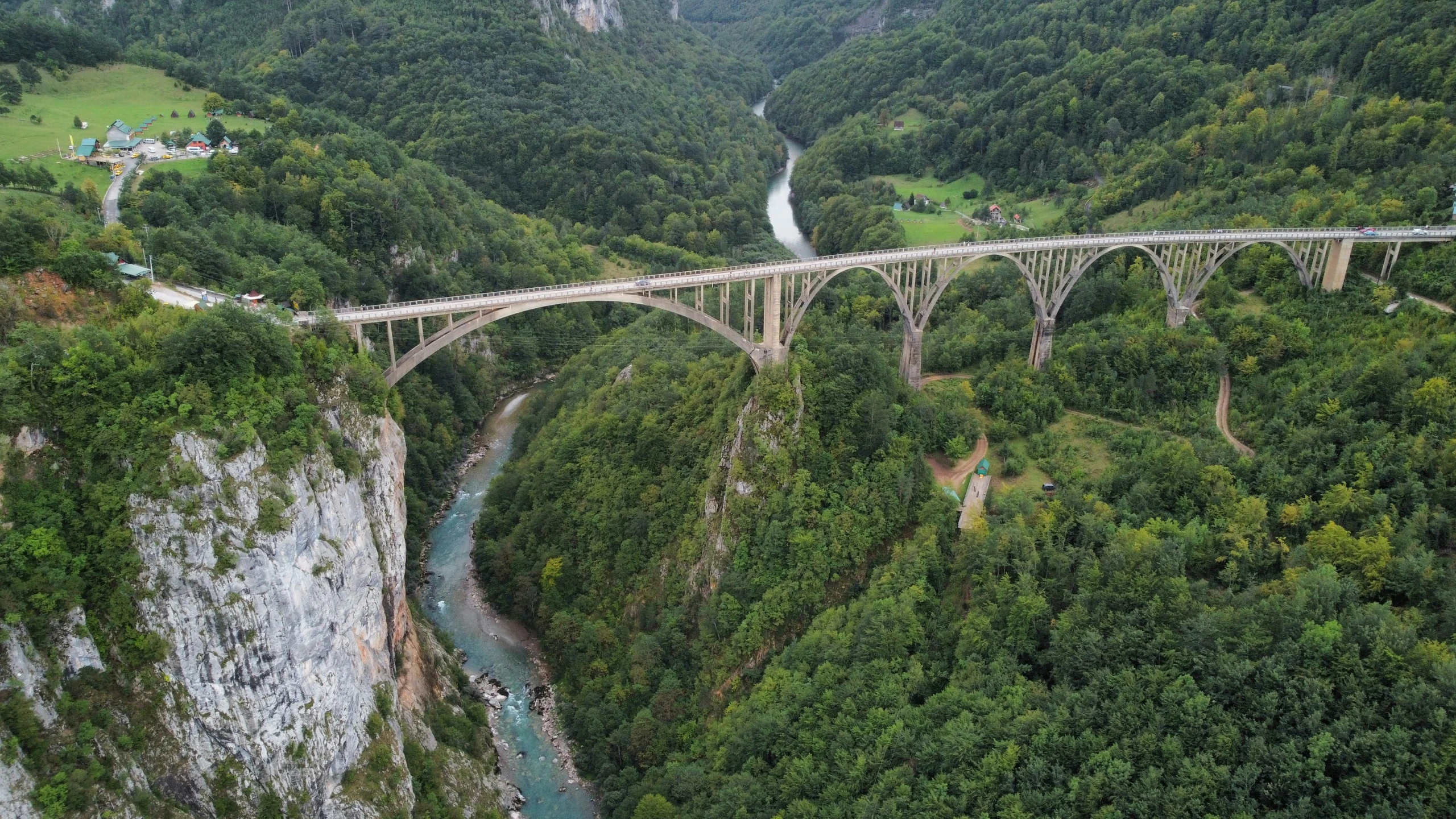 a bridge is crossing over a narrow ravine