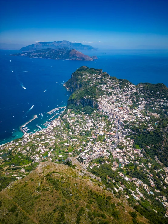 aerial view of village, beach and ocean in the foreground