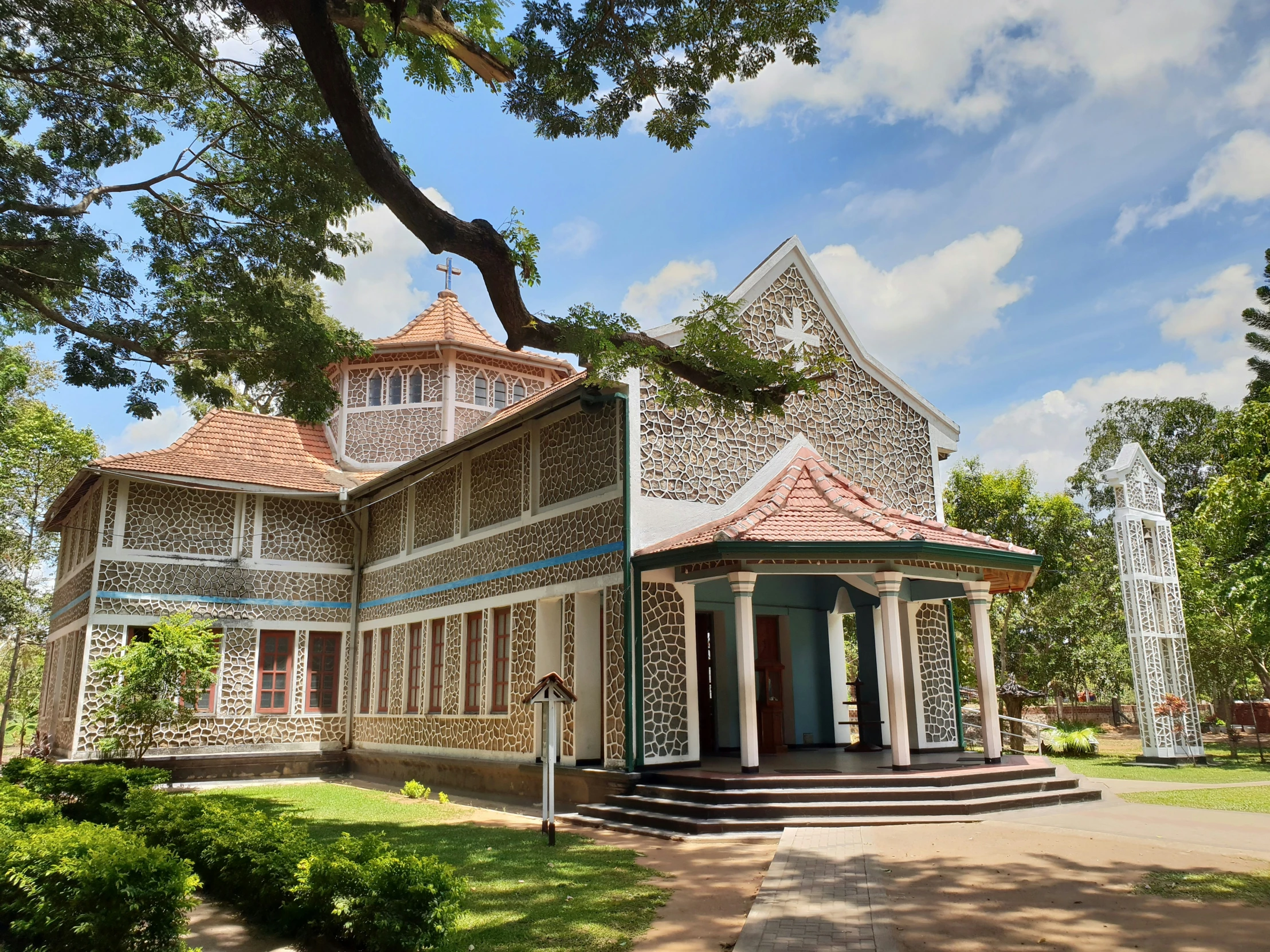 a building sitting on top of a lush green park