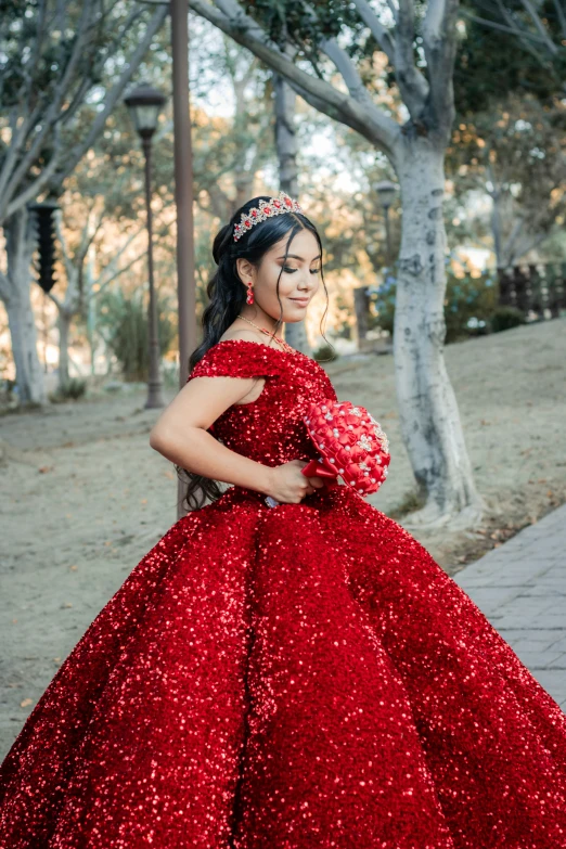 a woman is wearing a dress made from sequins