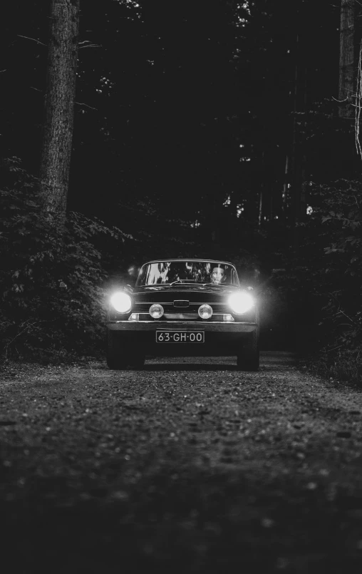 a black and white po of a car with headlights