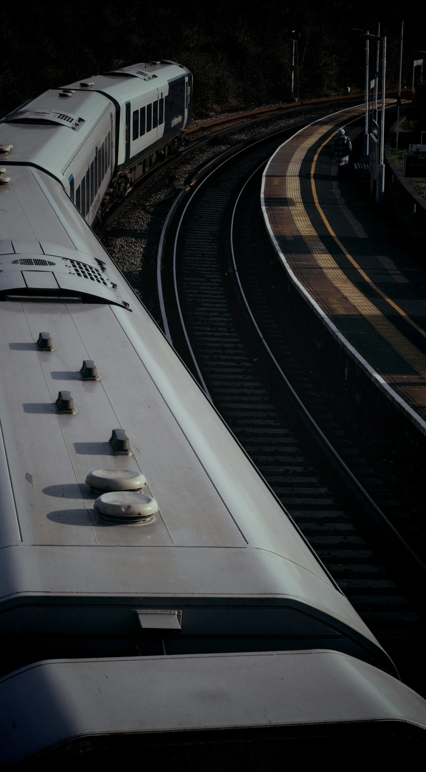 two trains moving along the tracks together