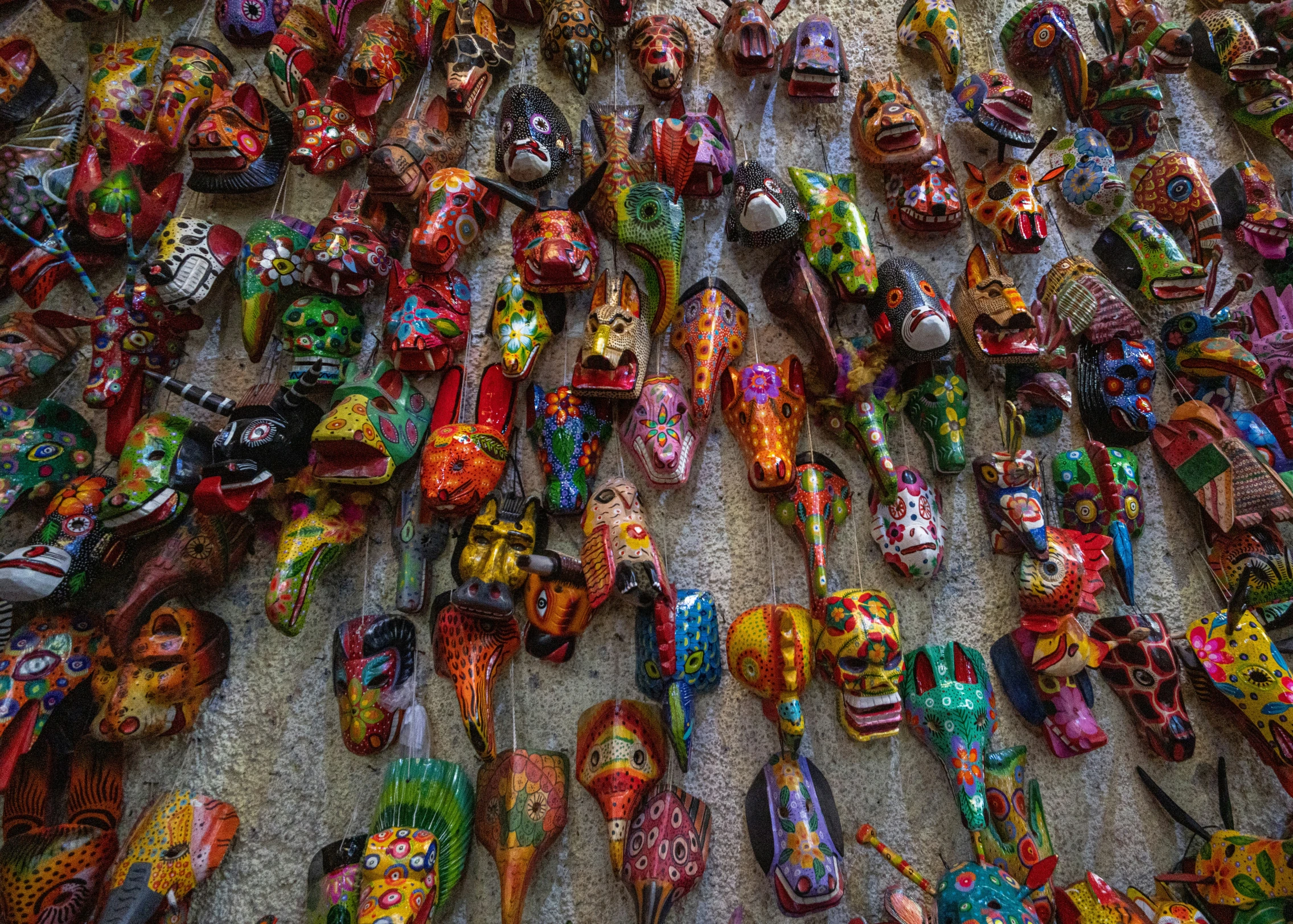 a lot of shoes laid out in a pile together