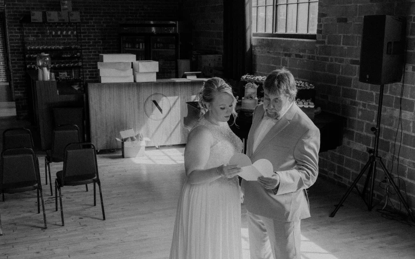 two people in formal dress dancing at a wedding