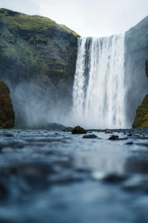 this is a waterfall with a view of water pouring over the top