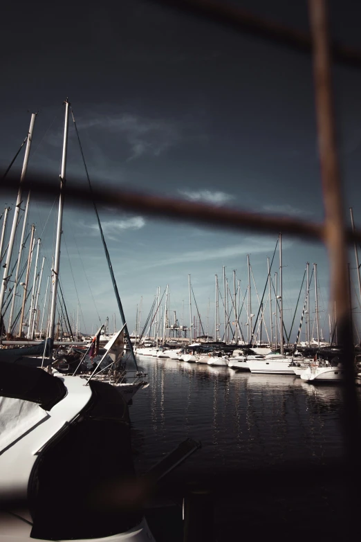 small boats in water with cloudy sky in background