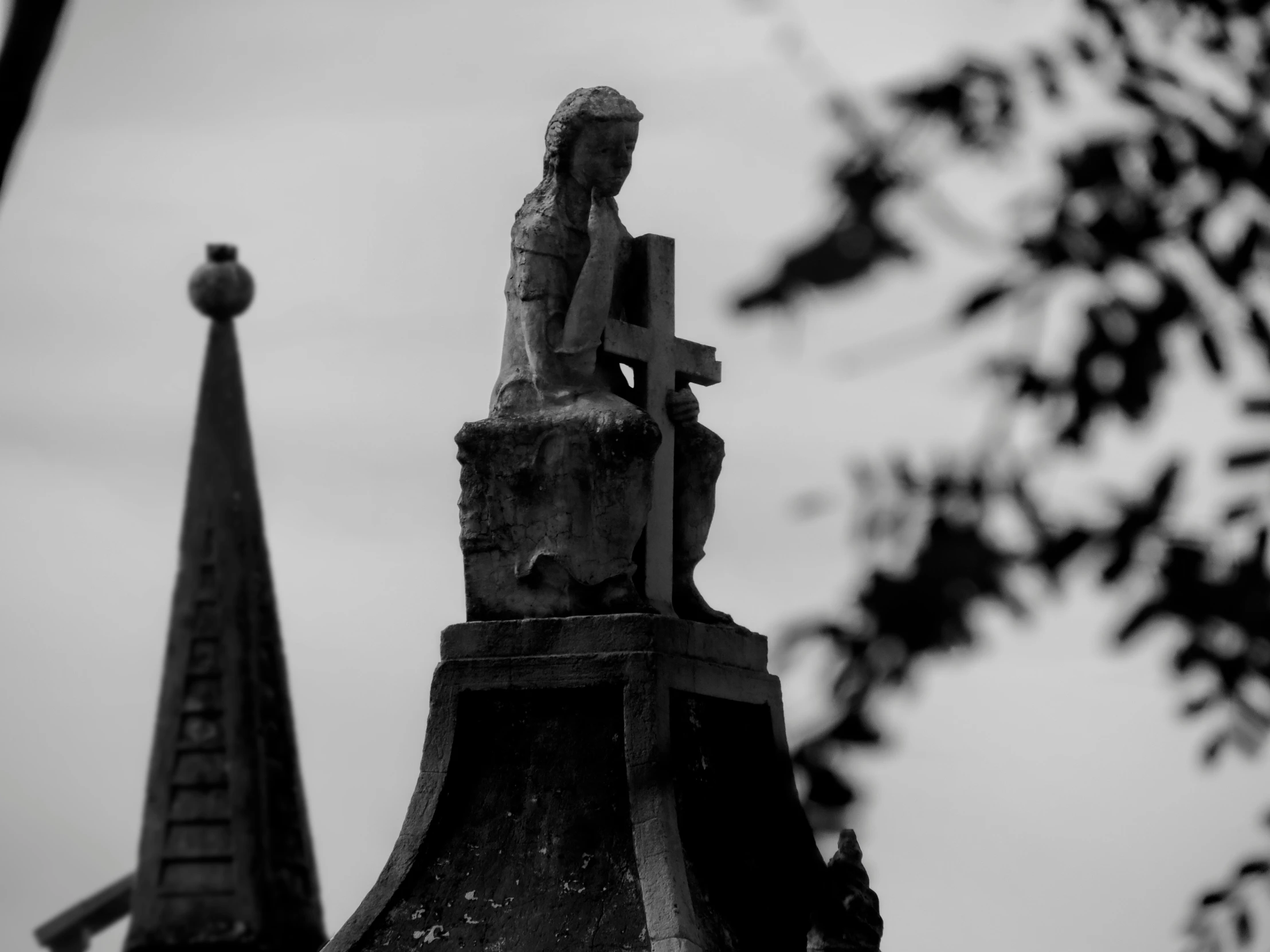 a close up of a statue on top of a building