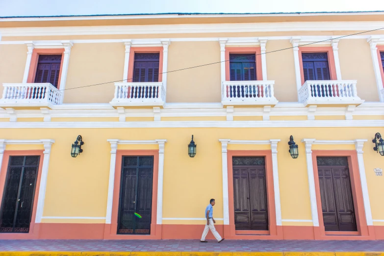 a large building with two tall doors in front of it