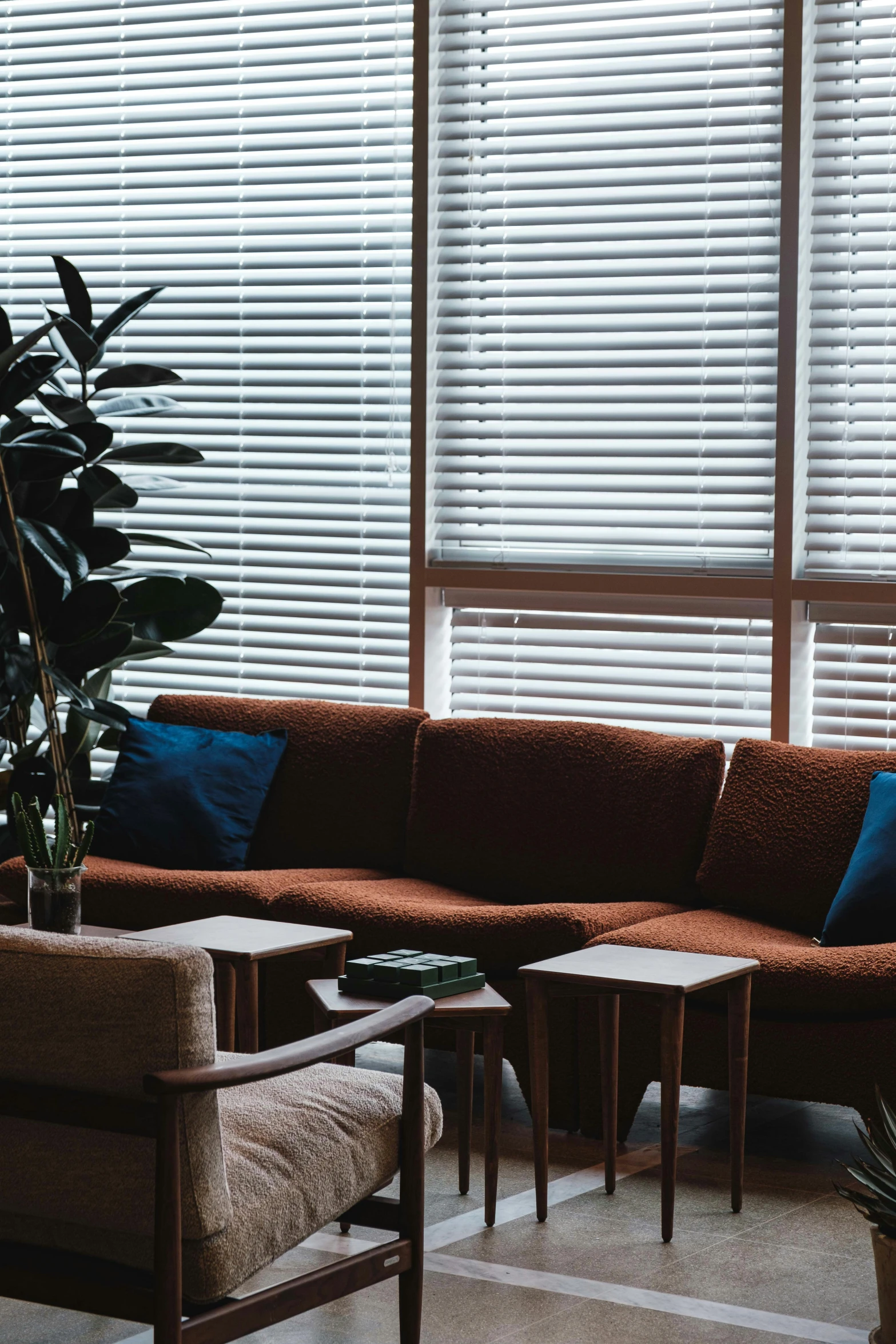 a couch and chair by the window in a living room