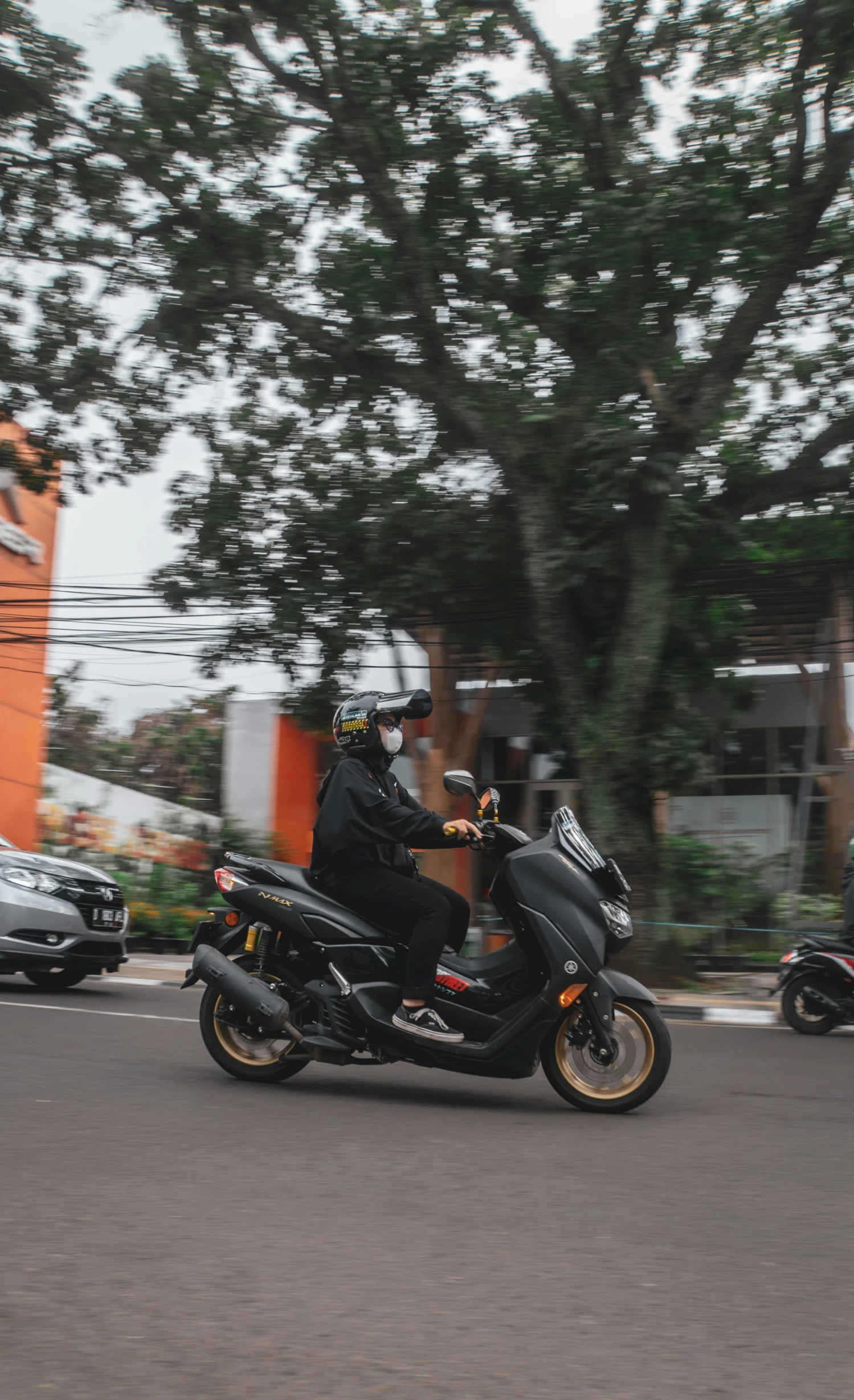 there is a man that is riding a motorcycle