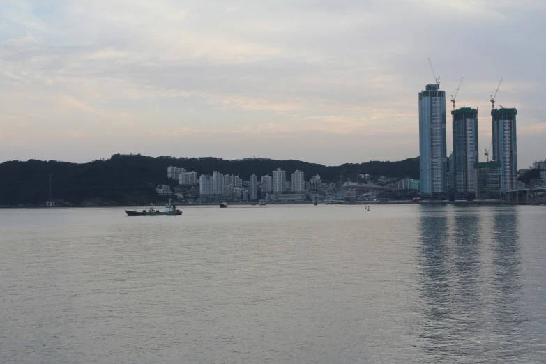 an urban city by the water and some boats on it