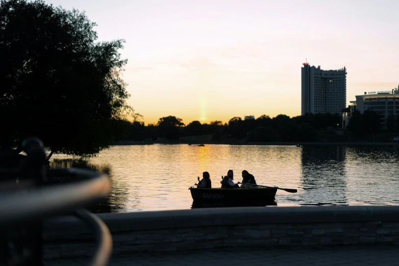 a small boat filled with people is floating in the water