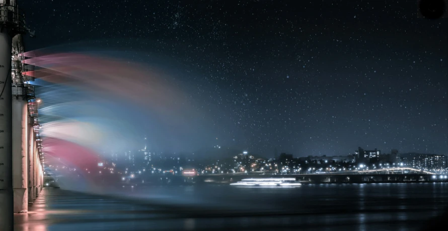 a large long exposure po of the city lights in the distance