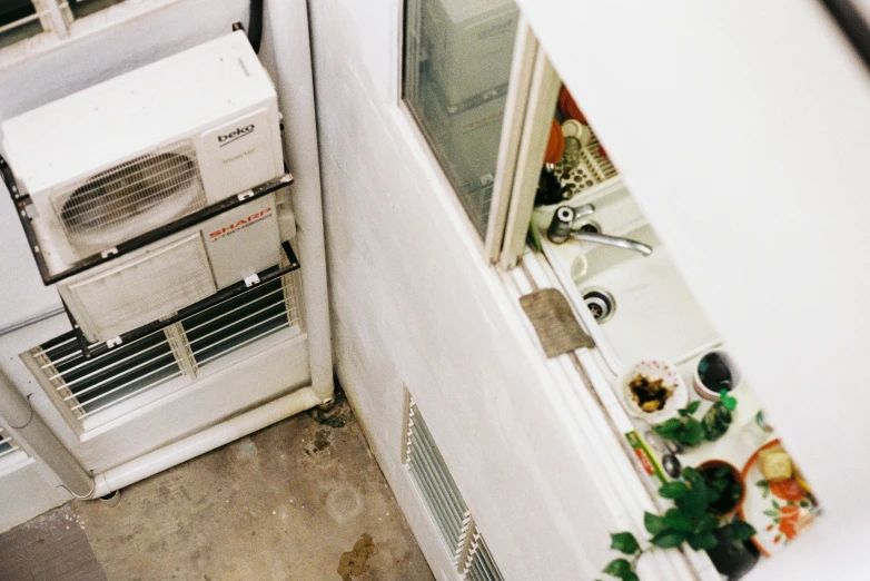 a fridge and stove next to the outside kitchen