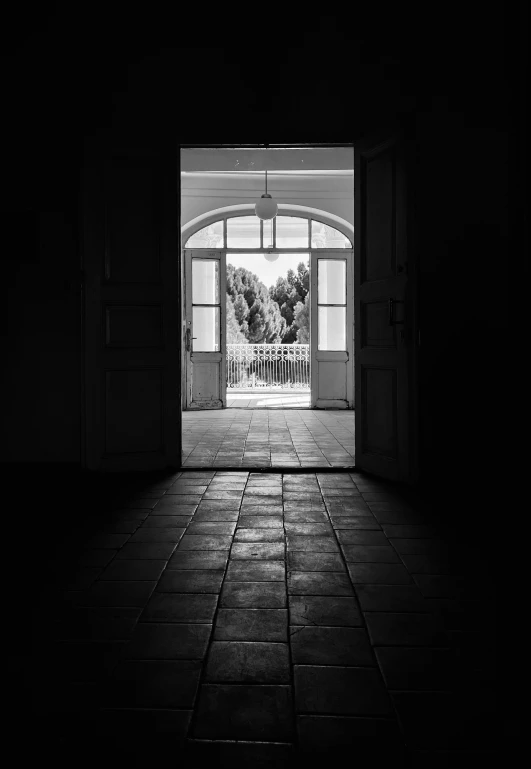 a black and white po of an open door with the words dark