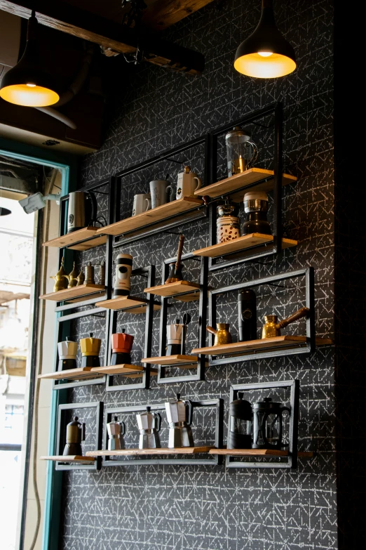 a wall with lots of shelves filled with coffee cups