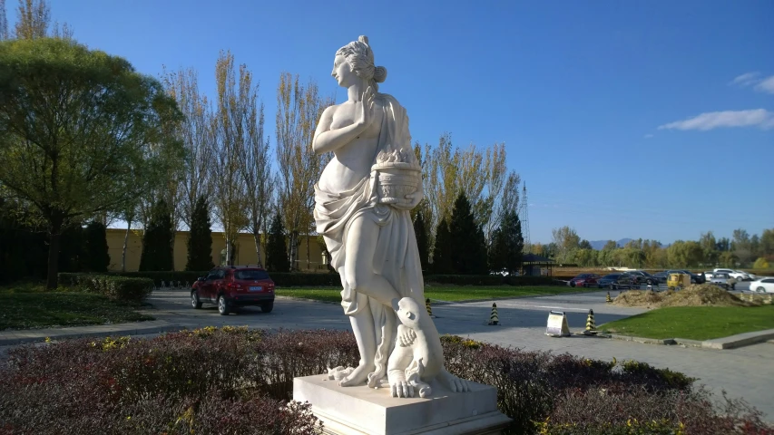 a statue of a woman and a man in the yard