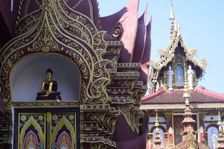 a statue and intricate buildings in a city