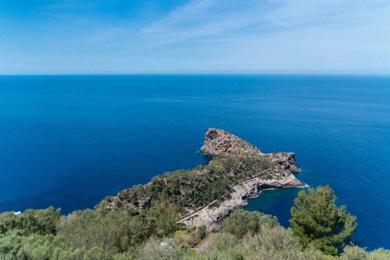 a cliff is shown overlooking the water on the side