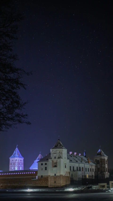 a nighttime view of a large building in the city