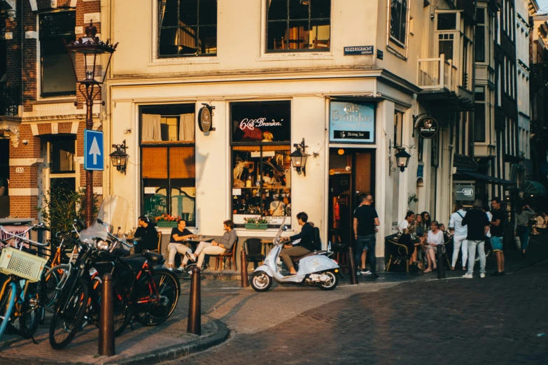 a street scene with people standing in front of a store