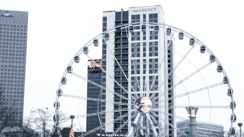 a large ferris wheel in a big city