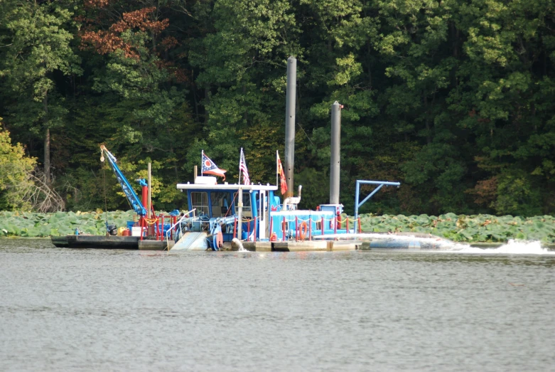 a small tugboat is sailing through the water