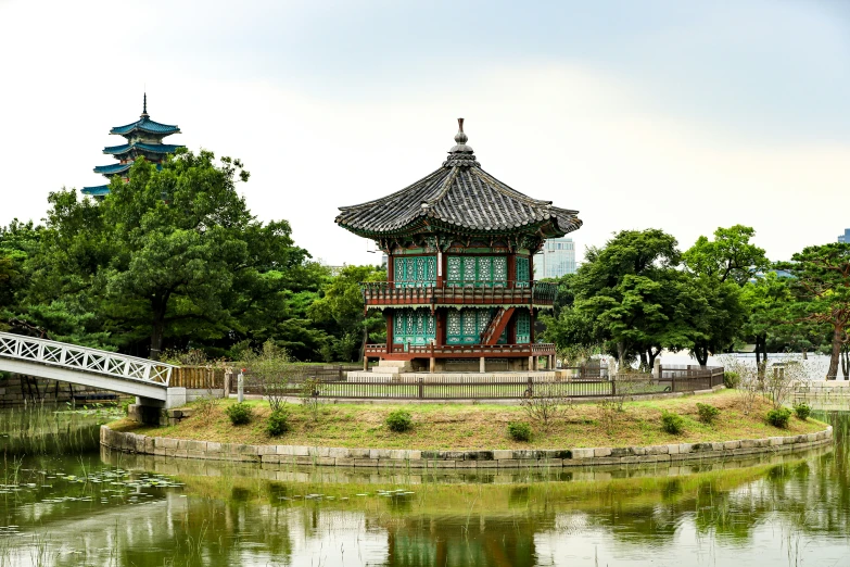 an ornate building stands out against the skyline of a river