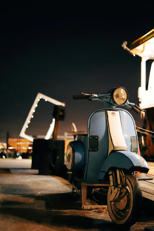 a scooter is parked near a gas station