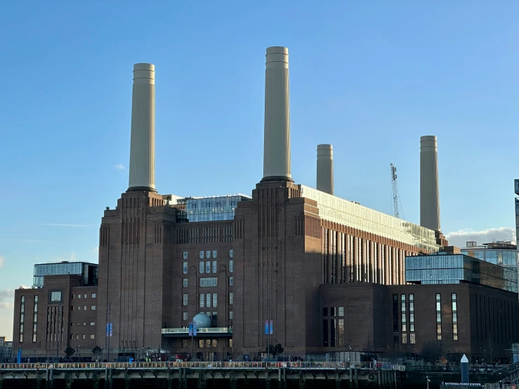 a building with smoke stacks standing on top of it