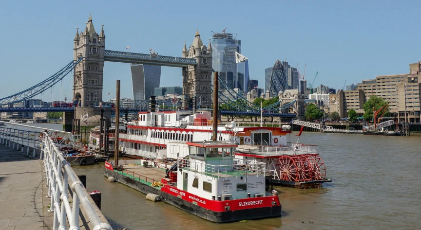 a large red and white boat is in the water