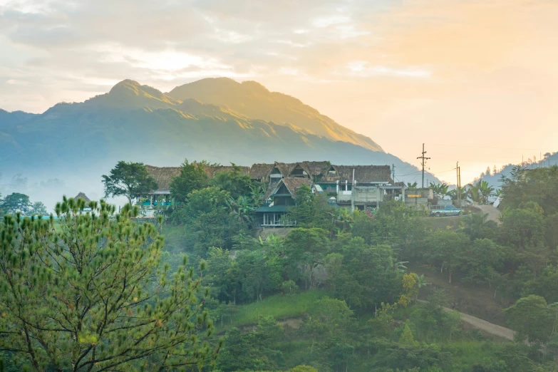 the view of a village near a mountain