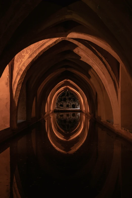 a tunnel is shown with a clock at the end