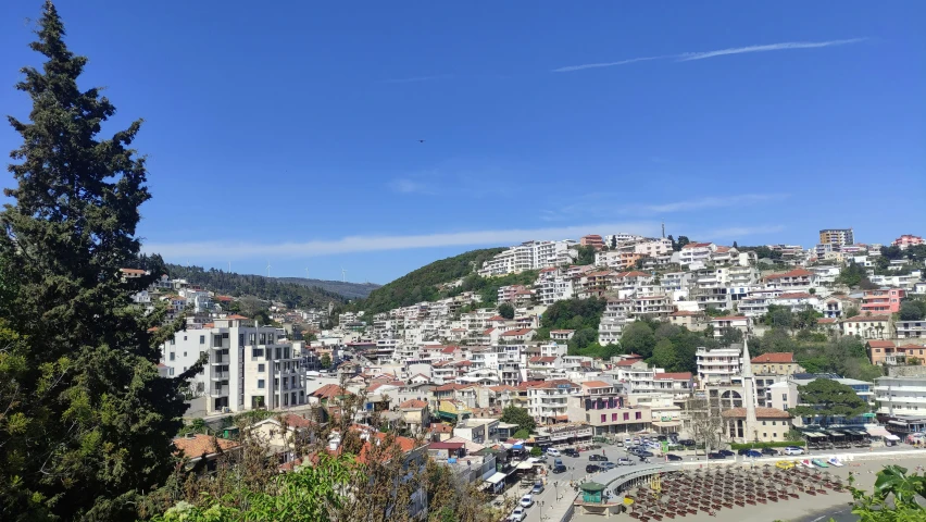 a hillside city with many houses on the top of it