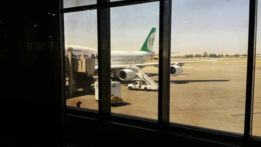 an airplane is being prepared at the airport