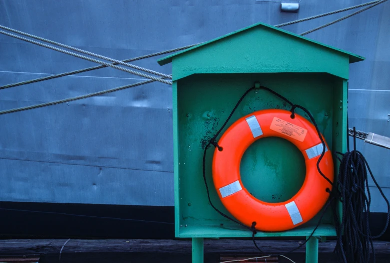 a life buoy is placed on the deck of a boat