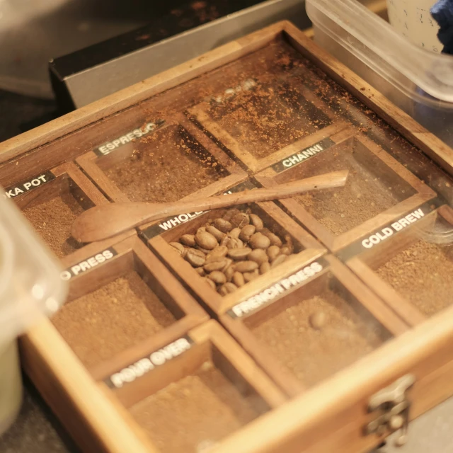 drawers and lids open showing seeds inside