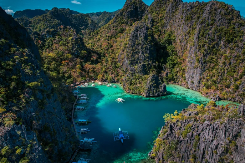 boats on a river near the cliffs