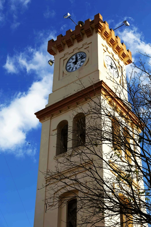 the tower of the building has a clock on it