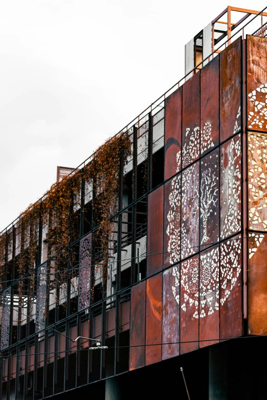 building with ornate window panels and metal balconies