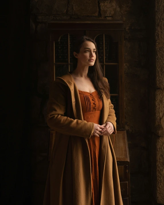 a beautiful young woman dressed in brown poses for a po