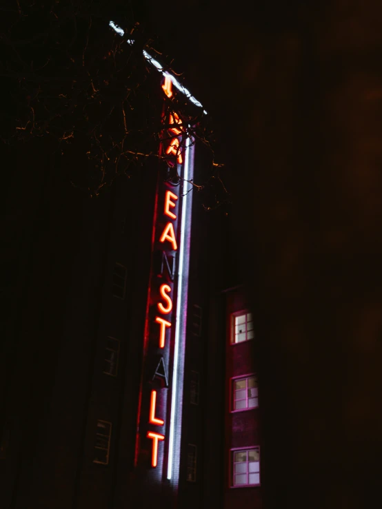 the marquee is lit up at night for an outside event