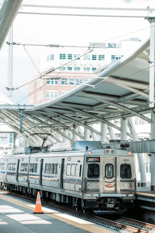 an empty train station with two trains parked at the platform