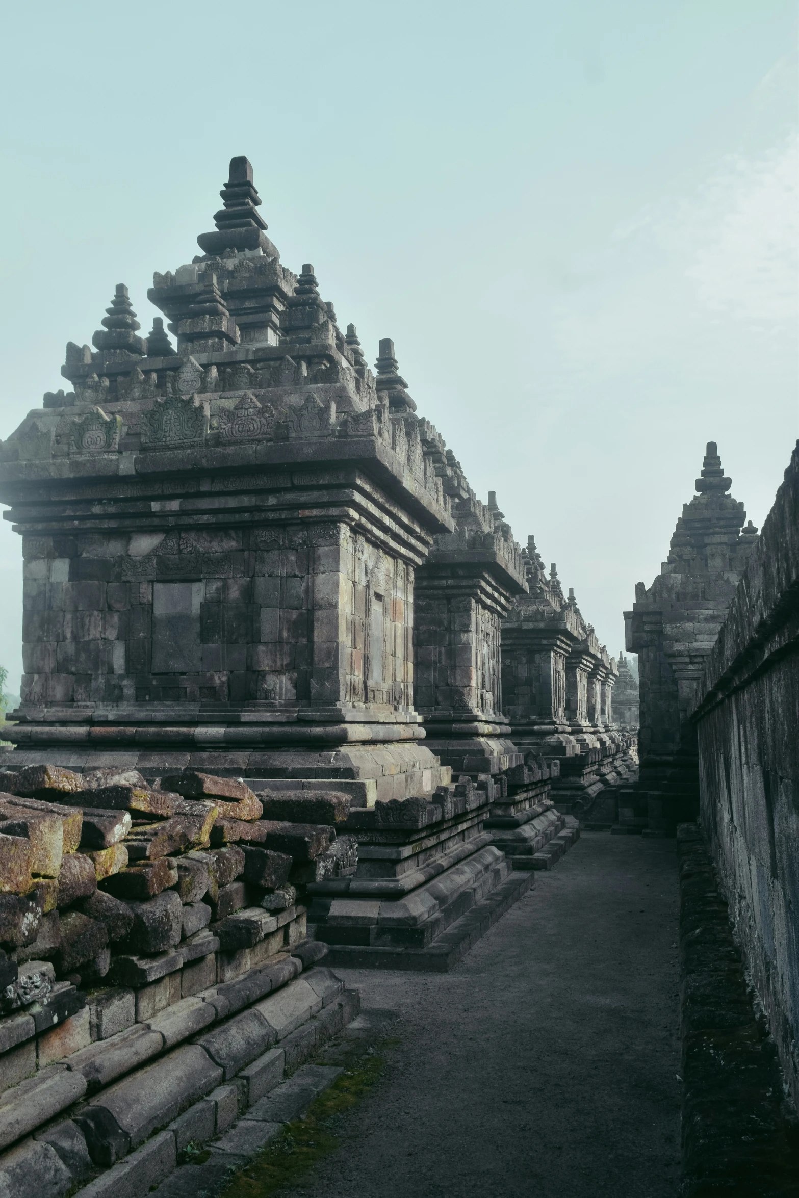 many buildings with some sculptures on the top of it